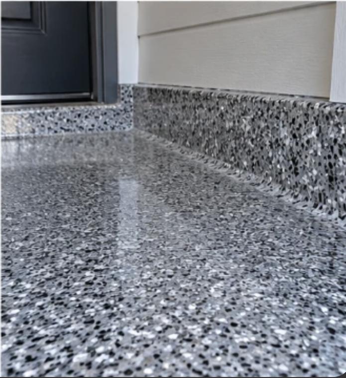 Flake epoxy coating carried up the wall as a cove base